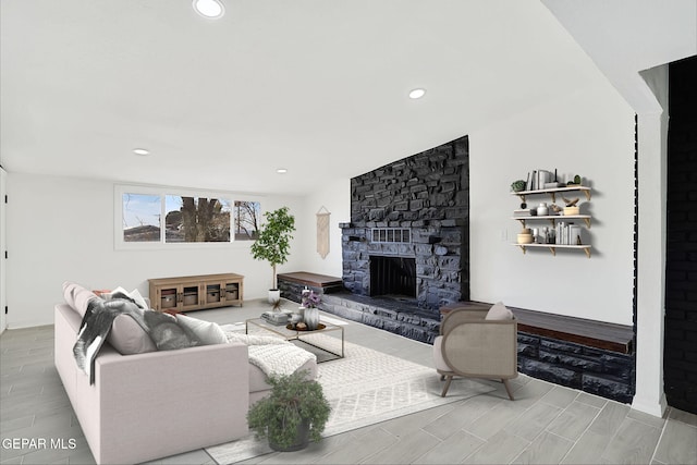 living area featuring a fireplace and recessed lighting