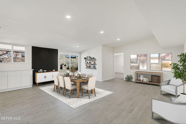 dining space with recessed lighting, vaulted ceiling, and wood finish floors