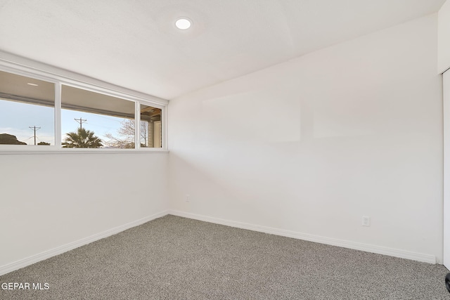 carpeted empty room with recessed lighting and baseboards