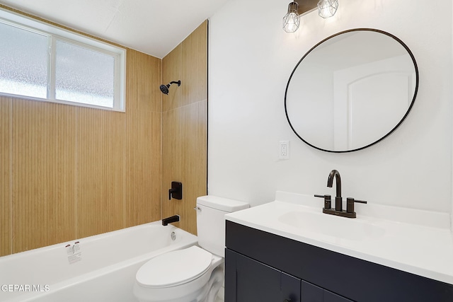 bathroom featuring toilet, washtub / shower combination, and vanity