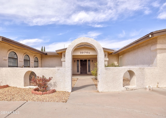 view of front of house featuring stucco siding