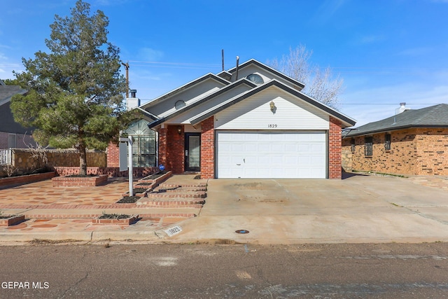 ranch-style home with a garage, brick siding, and concrete driveway