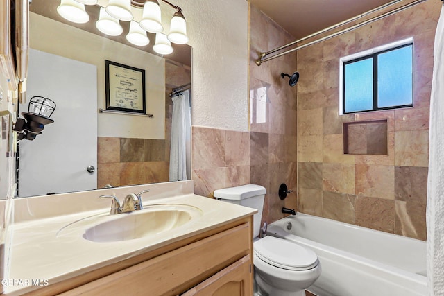 bathroom with shower / bath combination with curtain, tile walls, vanity, and toilet