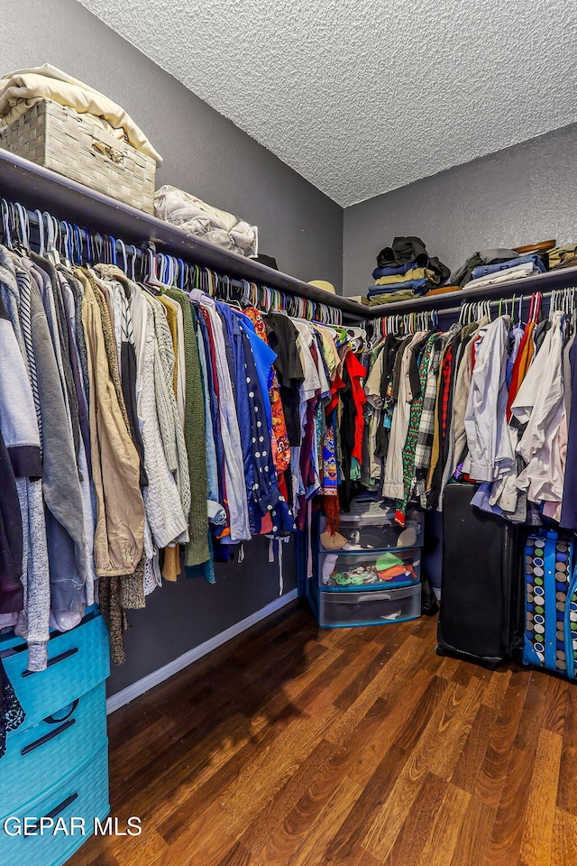 spacious closet with wood finished floors