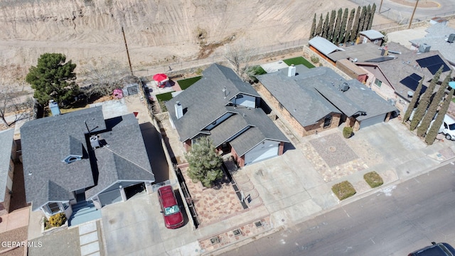 birds eye view of property with a residential view