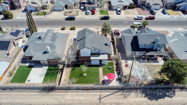 birds eye view of property with a residential view