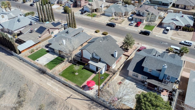 birds eye view of property with a residential view