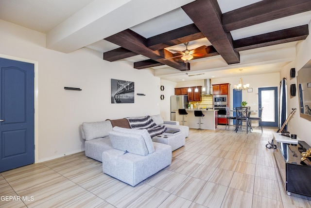 living area with beamed ceiling, ceiling fan with notable chandelier, baseboards, and coffered ceiling