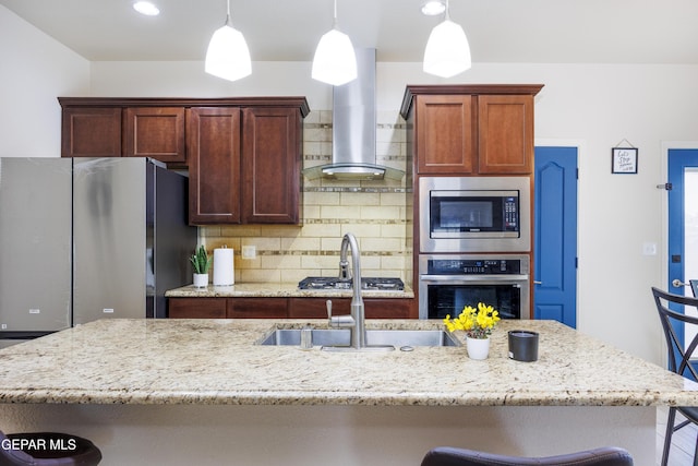 kitchen with tasteful backsplash, a breakfast bar, light stone counters, appliances with stainless steel finishes, and island exhaust hood