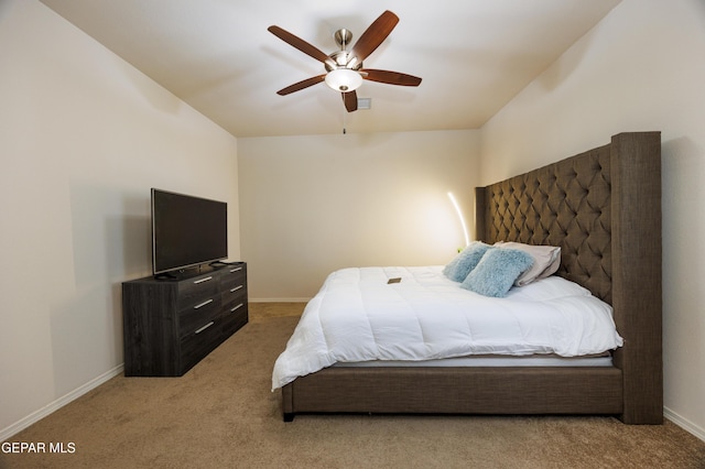 bedroom featuring ceiling fan, baseboards, and carpet