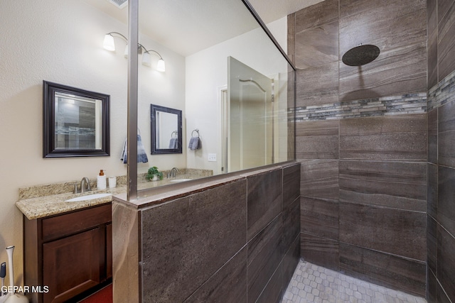 bathroom with vanity and a walk in shower