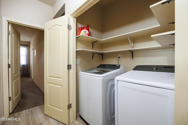 washroom featuring washer and dryer and laundry area