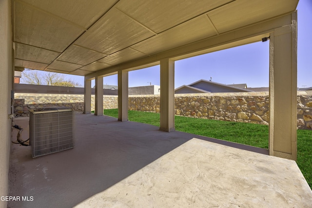 view of patio / terrace with cooling unit and fence