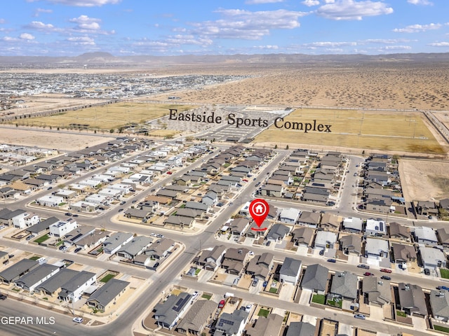 bird's eye view with a residential view and a mountain view