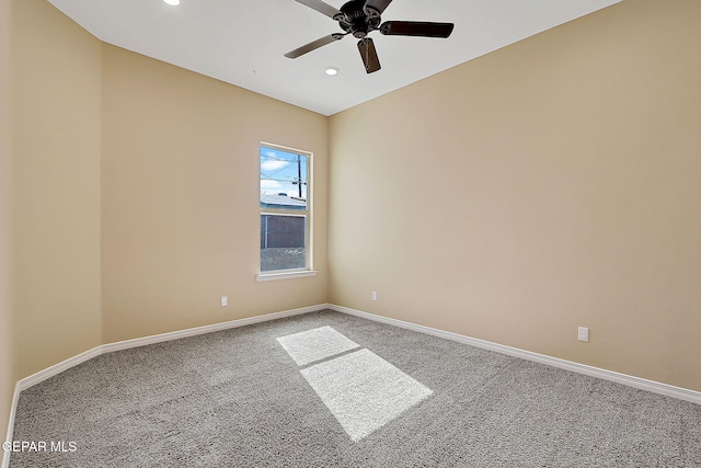 spare room featuring recessed lighting, carpet flooring, and baseboards