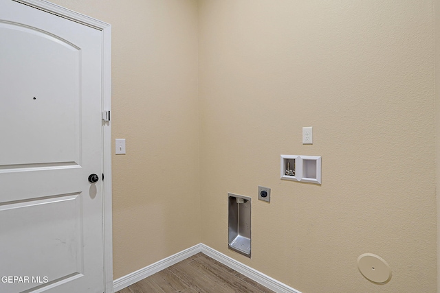 washroom with hookup for an electric dryer, laundry area, washer hookup, wood finished floors, and baseboards