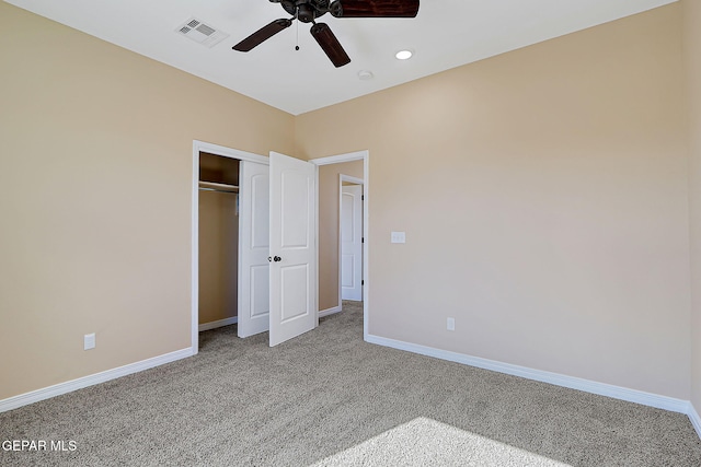 unfurnished bedroom featuring baseboards, visible vents, a ceiling fan, carpet floors, and a closet