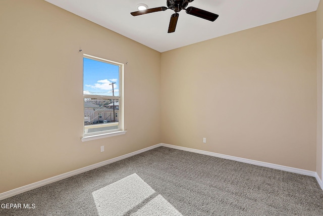 unfurnished room featuring carpet floors, baseboards, and a ceiling fan