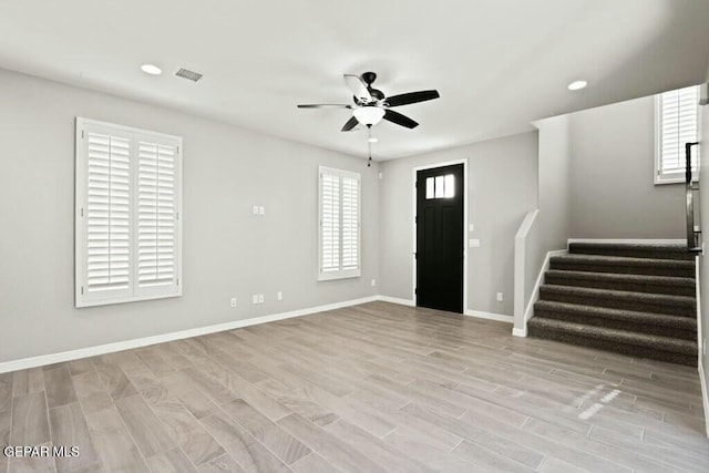 entryway featuring baseboards, stairway, recessed lighting, light wood-style floors, and a ceiling fan