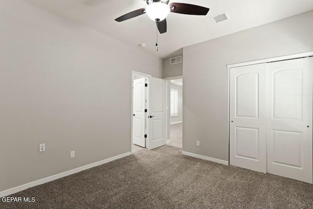 unfurnished bedroom featuring visible vents, carpet floors, baseboards, and a closet