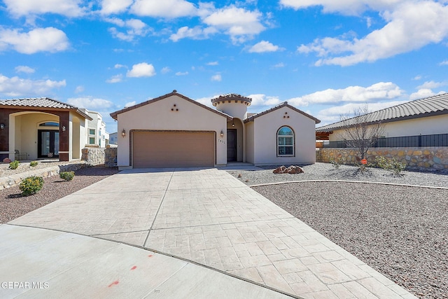 mediterranean / spanish-style house with french doors, stucco siding, an attached garage, fence, and driveway