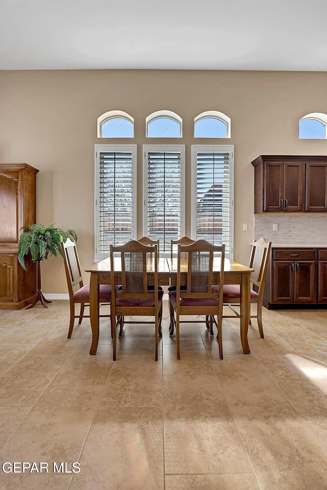 dining space featuring light tile patterned floors