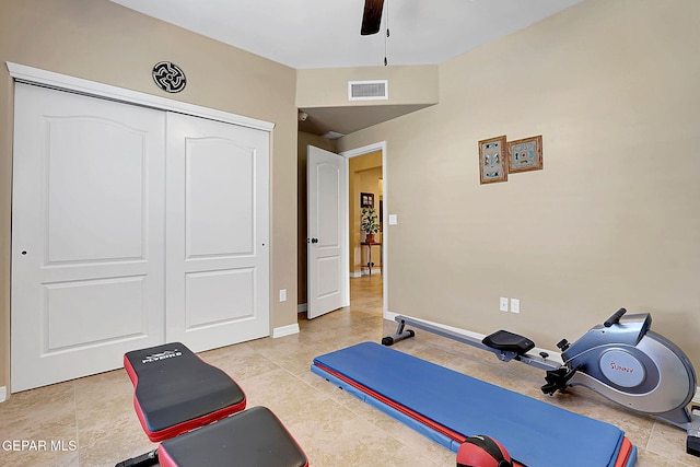 workout area featuring ceiling fan, visible vents, and baseboards