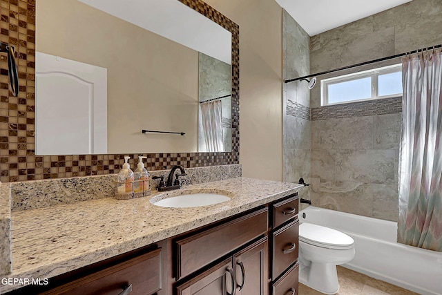 full bath featuring toilet, tasteful backsplash, shower / bath combo with shower curtain, and vanity