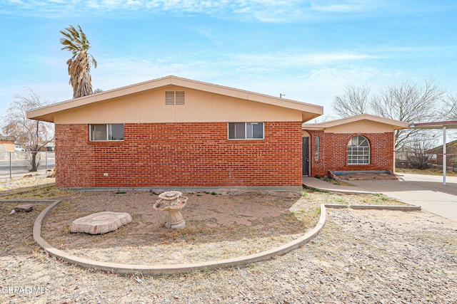 exterior space featuring brick siding