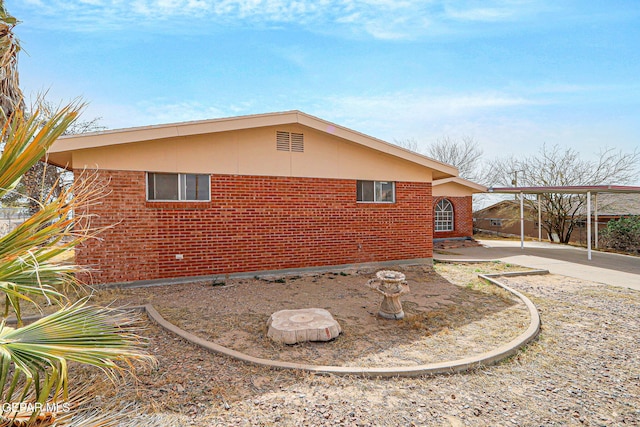 view of side of property with brick siding