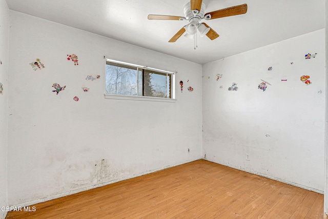 spare room featuring light wood-type flooring and ceiling fan