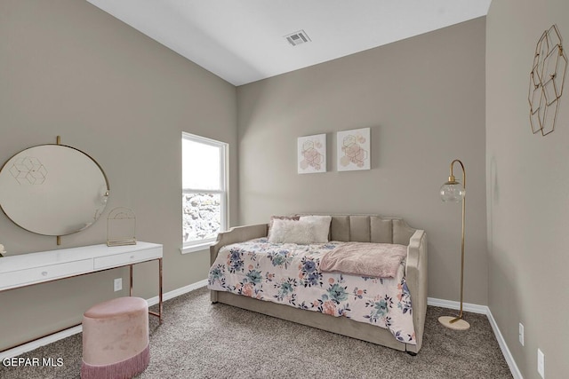 carpeted bedroom with visible vents and baseboards