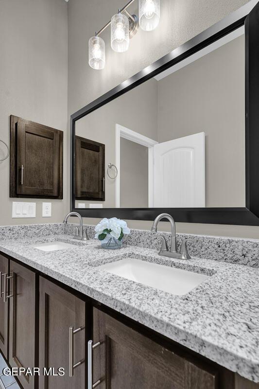 bathroom with double vanity and a sink