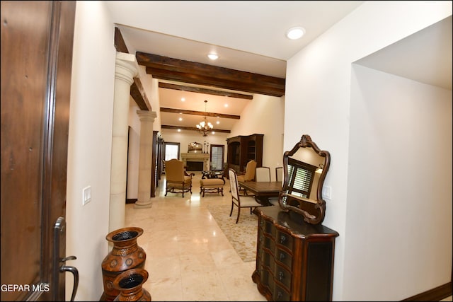 hallway with a chandelier, beam ceiling, decorative columns, and recessed lighting