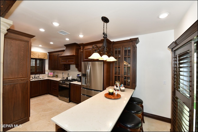 kitchen with stainless steel appliances, light countertops, and visible vents