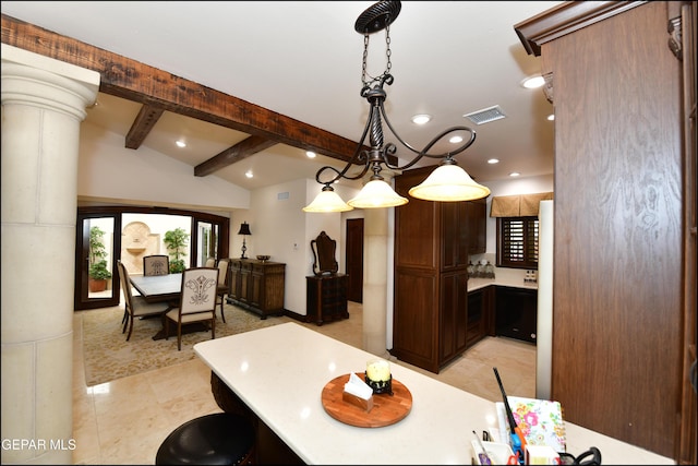 kitchen with lofted ceiling with beams, recessed lighting, visible vents, light countertops, and ornate columns