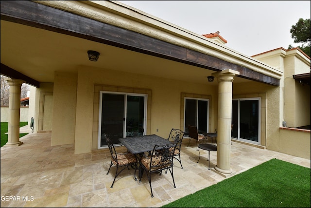 view of patio featuring outdoor dining area