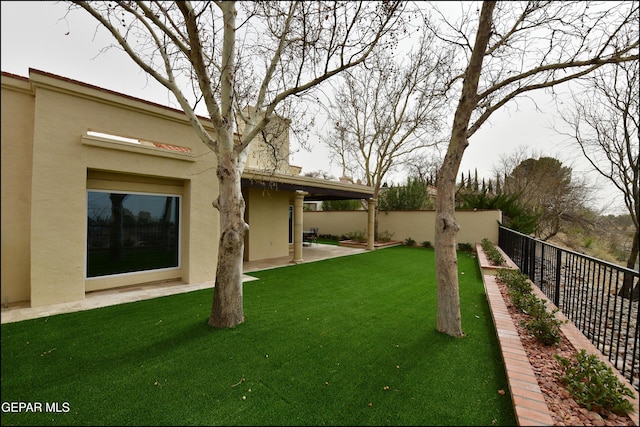 view of yard featuring a patio area and a fenced backyard