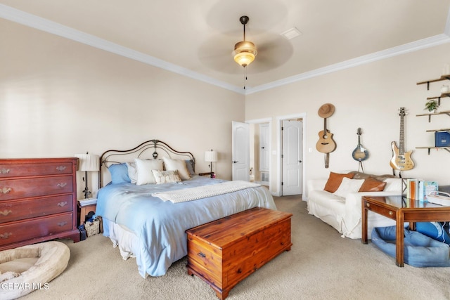 carpeted bedroom featuring ceiling fan and crown molding