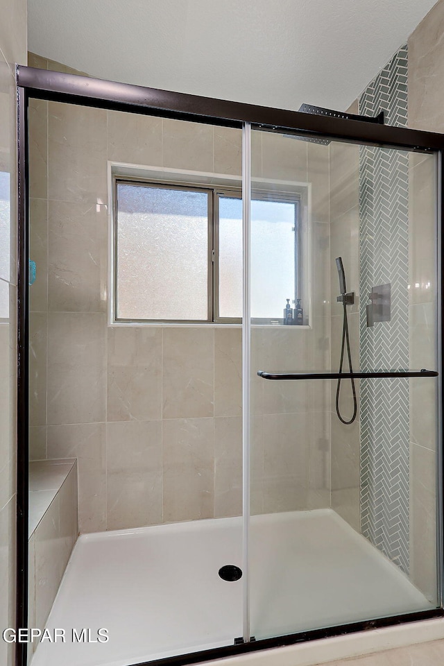 bathroom with a stall shower