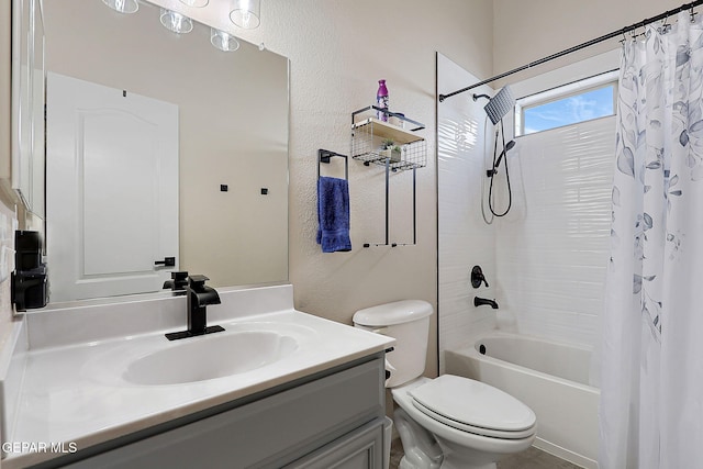 bathroom featuring toilet, a textured wall, vanity, and shower / tub combo with curtain