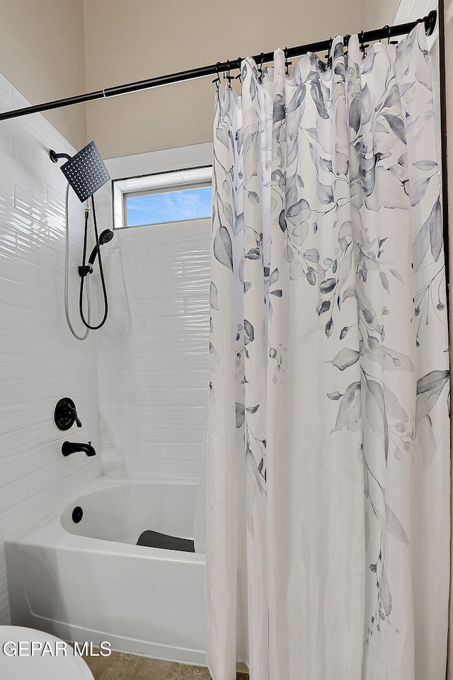 full bathroom featuring shower / tub combo with curtain