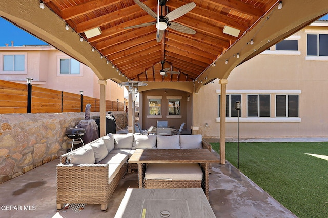 view of patio featuring outdoor dining area, outdoor lounge area, fence, and ceiling fan