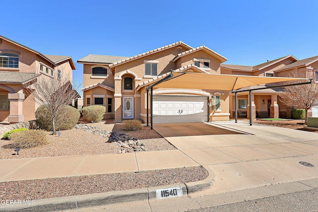 mediterranean / spanish-style house featuring driveway, a tiled roof, and stucco siding