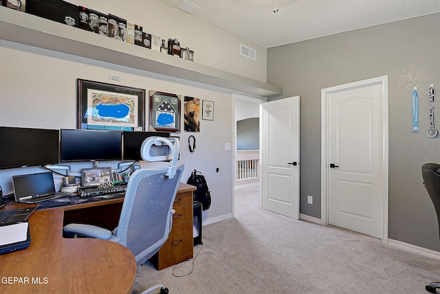 office with light colored carpet, visible vents, and baseboards