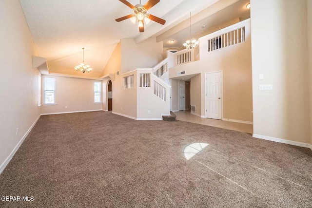 unfurnished living room with visible vents, stairway, carpet, high vaulted ceiling, and ceiling fan with notable chandelier