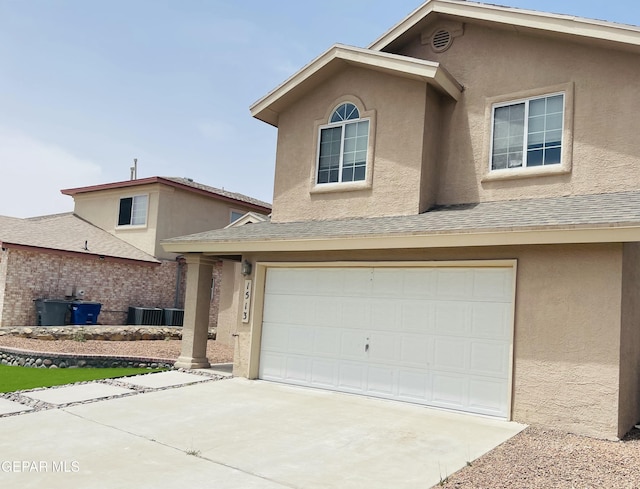 1513 Prickley Pear Dr, El Paso, TX 79912 - view of front of property featuring stucco siding, concrete driveway, a garage, and roof with shingles