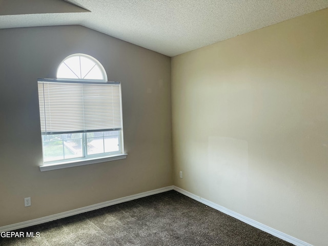 1513 Prickley Pear Dr, El Paso, TX 79912 - carpeted spare room with baseboards, a textured ceiling, and vaulted ceiling