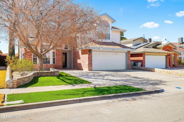 view of front facade featuring brick siding, driveway, and an attached garage