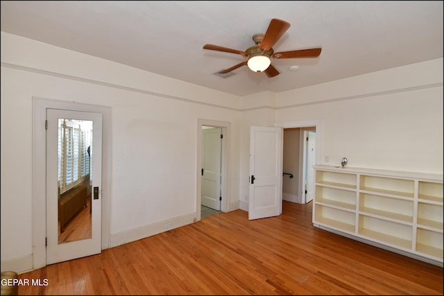 unfurnished bedroom featuring light wood finished floors and baseboards